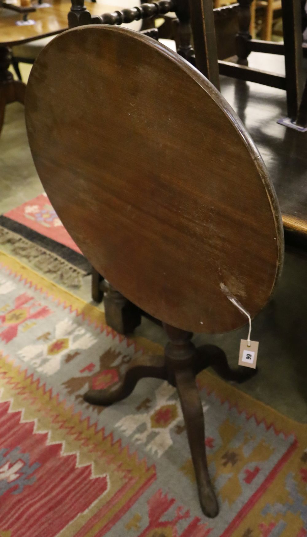 A George III circular mahogany tilt top tripod tea table, 68cm diameter